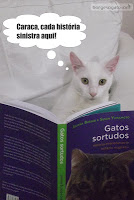 Gatinho branco lendo o livro Gatos Sortudos